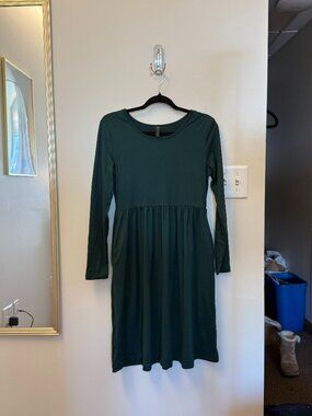 long sleeve dress with flowy bottom. Pocket on either side. Appropriate for casu